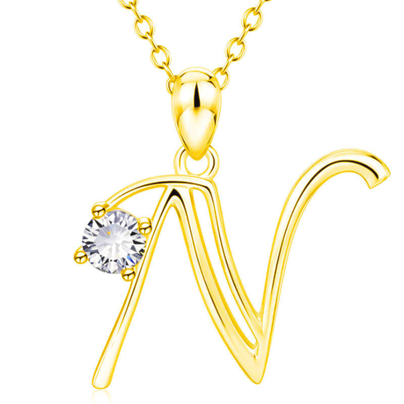 Collier avec initiale en or et strass tendance